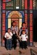 China: Young boys in front of their home's brightly decorated doors in Old Kuqa, Xinjiang Province